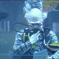 Reading his poetry underwater, in the marine aquarium